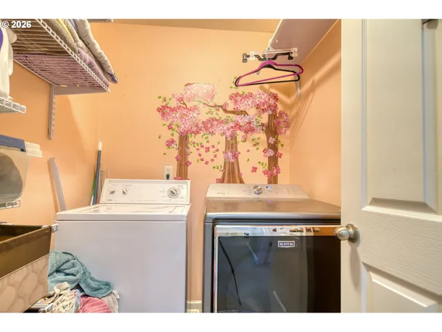 a utility room with a stove and a window