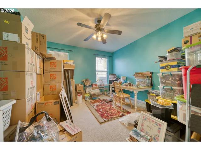 a living room with lots of furniture and a chandelier