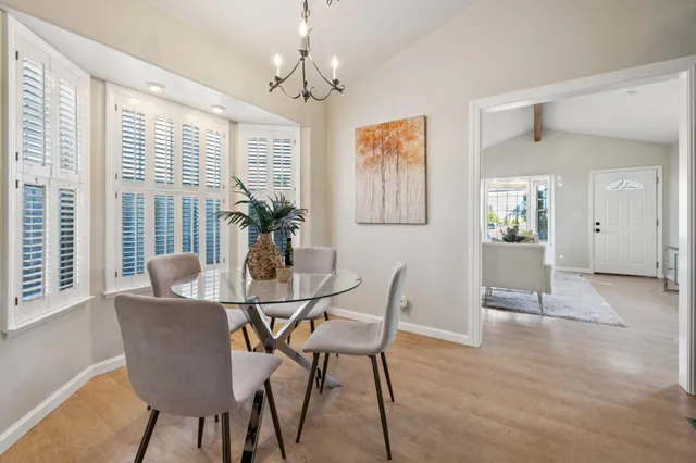 a dining room with furniture and window