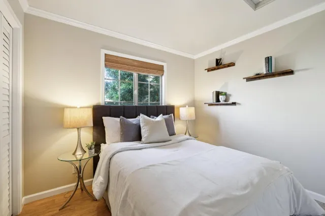 a bedroom with a bed and window