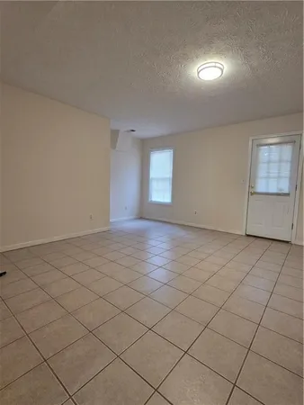 an empty room with a empty space and a window