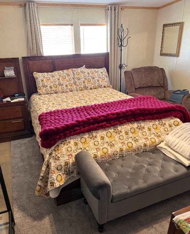 18504 Noyce Road Crosby, TX 77532 - Photo 16 of 24 a bed sitting in a bedroom next to a window