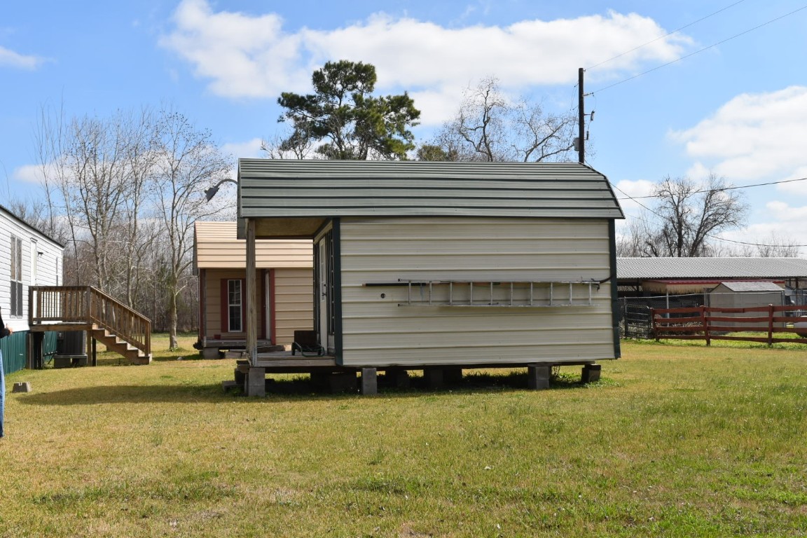 18504 Noyce Road Crosby, TX 77532 - Photo 22 of 24 a view of a house with a yard