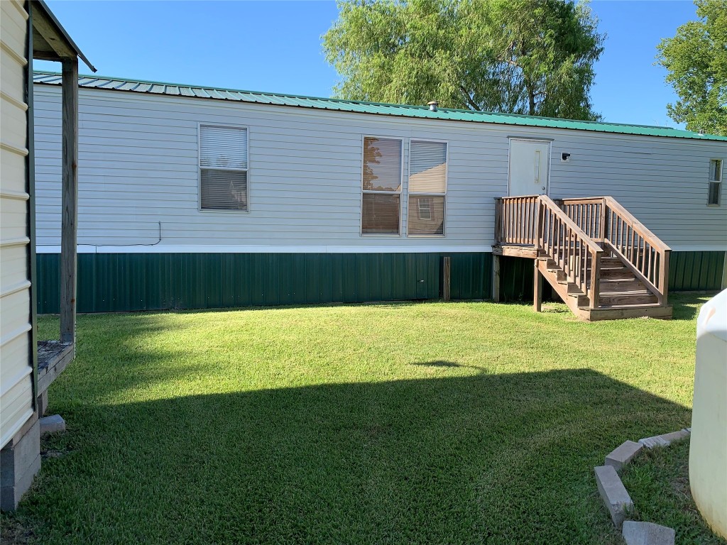 18504 Noyce Road Crosby, TX 77532 - Photo 4 of 24 a view of a house with a backyard