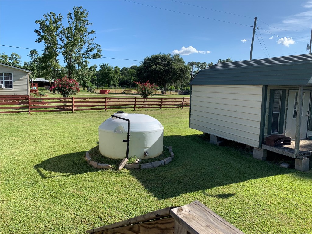 18504 Noyce Road Crosby, TX 77532 - Photo 5 of 24 a view of a backyard with sitting area