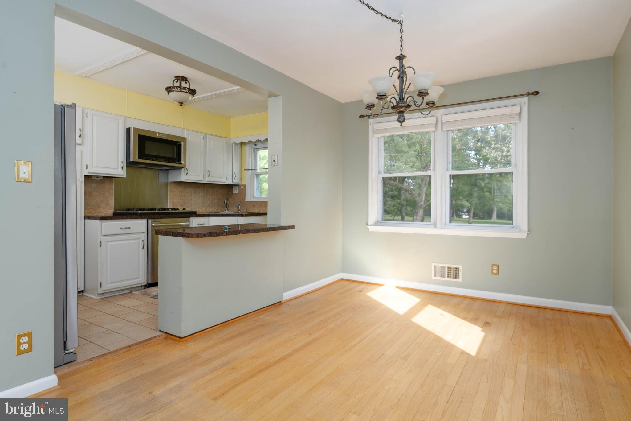 2256 Southorn Road Baltimore, MD 21220 - Photo 8 of 61 a kitchen with granite countertop white cabinets and window