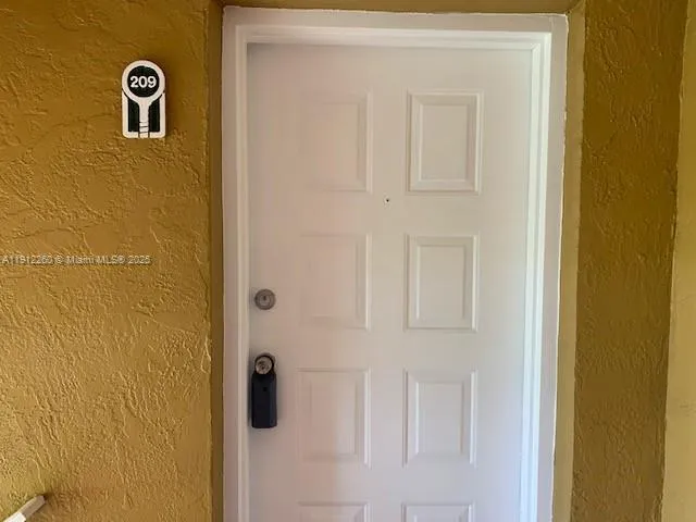 a view of a house with pool and sitting area