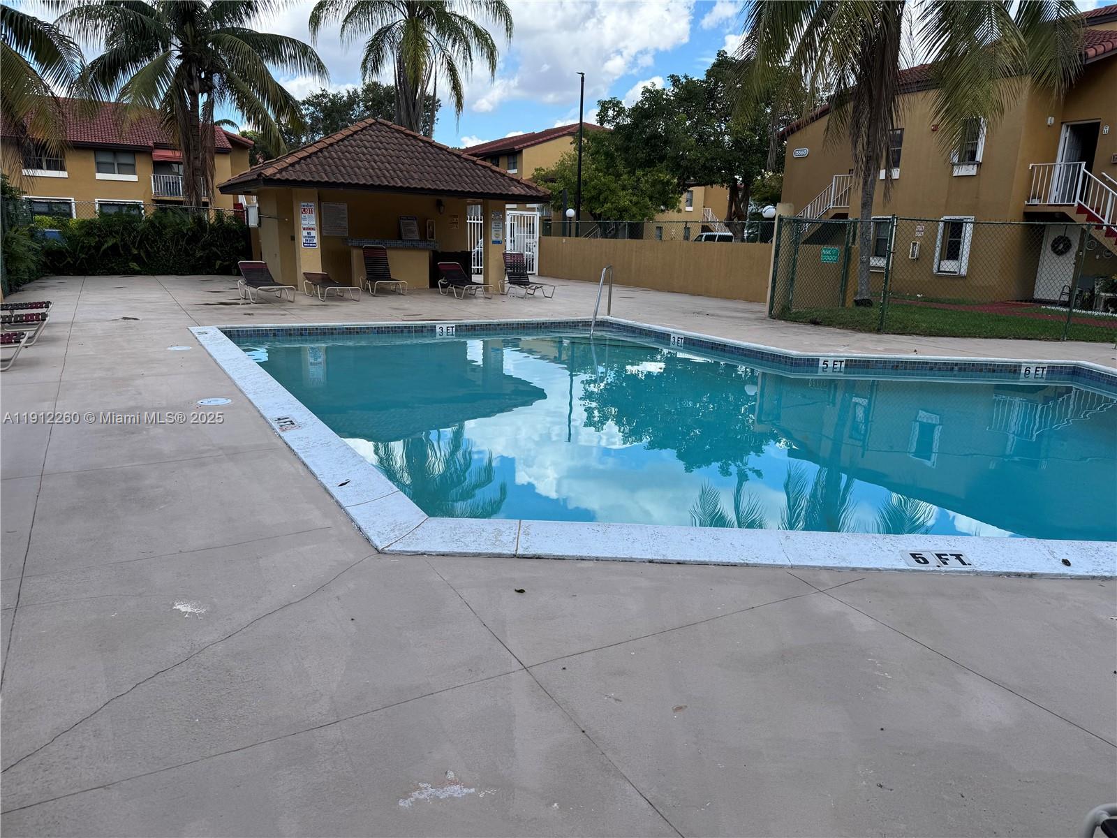 15630 Southwest 80th Street, Unit I209 Miami, FL 33193 - Photo 17 of 19 a view of a house with pool and sitting area
