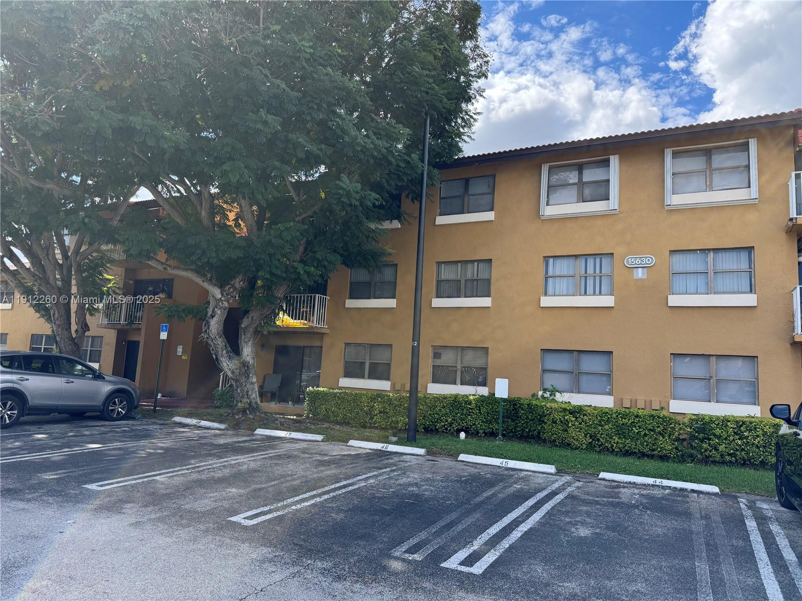 15630 Southwest 80th Street, Unit I209 Miami, FL 33193 - Photo 2 of 19 a view of a building with a street