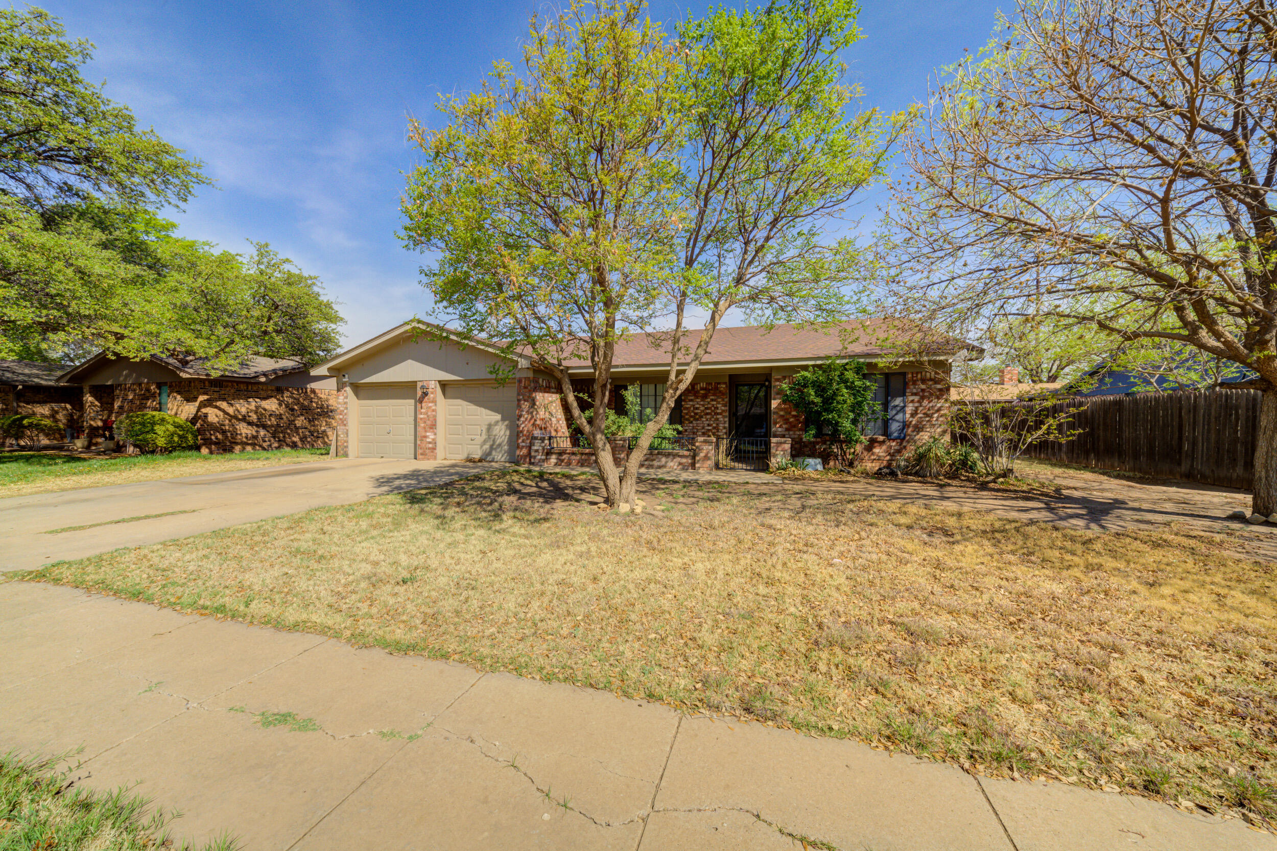 4804 71st Street Lubbock, TX 79424 - Photo 2 of 14 a front view of a house with a yard