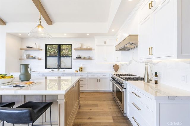 a kitchen with a stove and a sink