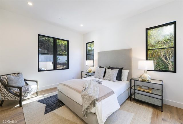 a bed room with a bed and a window