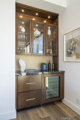 a bathroom with a sink mirror and vanity