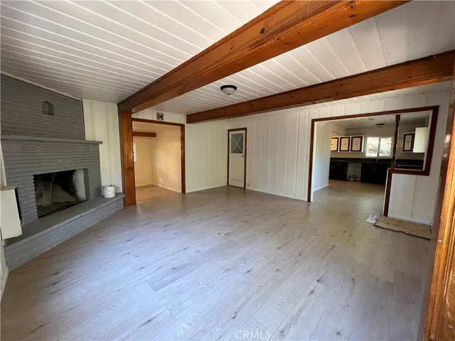 a view of a livingroom with wooden floor