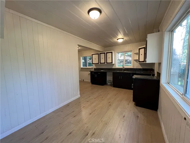 a kitchen with granite countertop stainless steel appliances and wooden cabinets