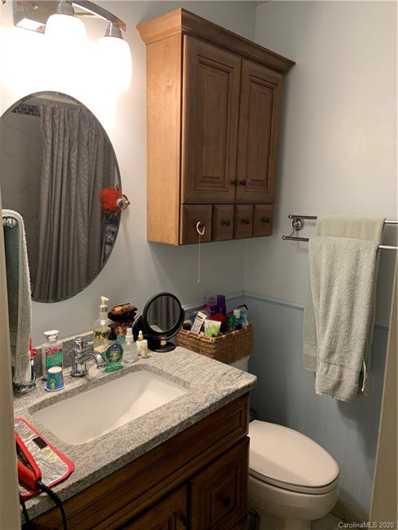 103 Sycamore Road, Unit 208 Salisbury, NC 28147 - Photo 11 of 20 a bathroom with a sink a toilet and mirror