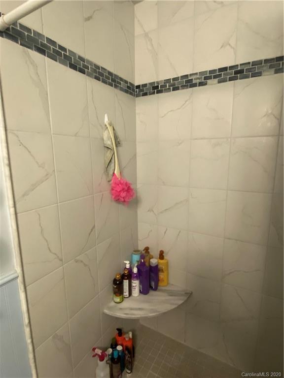 103 Sycamore Road, Unit 208 Salisbury, NC 28147 - Photo 13 of 20 a bathroom with a shower and a shower