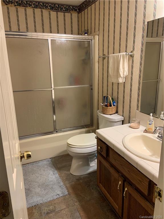 103 Sycamore Road, Unit 208 Salisbury, NC 28147 - Photo 18 of 20 a bathroom with a sink a toilet and shower