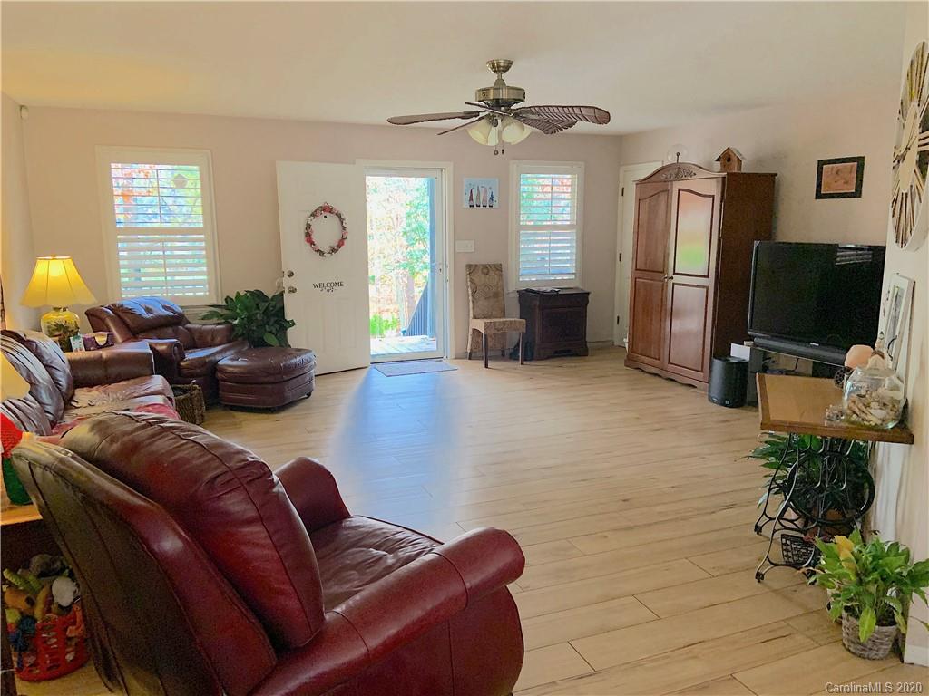 103 Sycamore Road, Unit 208 Salisbury, NC 28147 - Photo 3 of 20 a living room with furniture and a flat screen tv