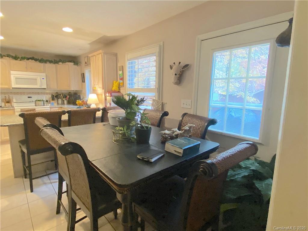 103 Sycamore Road, Unit 208 Salisbury, NC 28147 - Photo 6 of 20 a view of a dining room with furniture and wooden floor