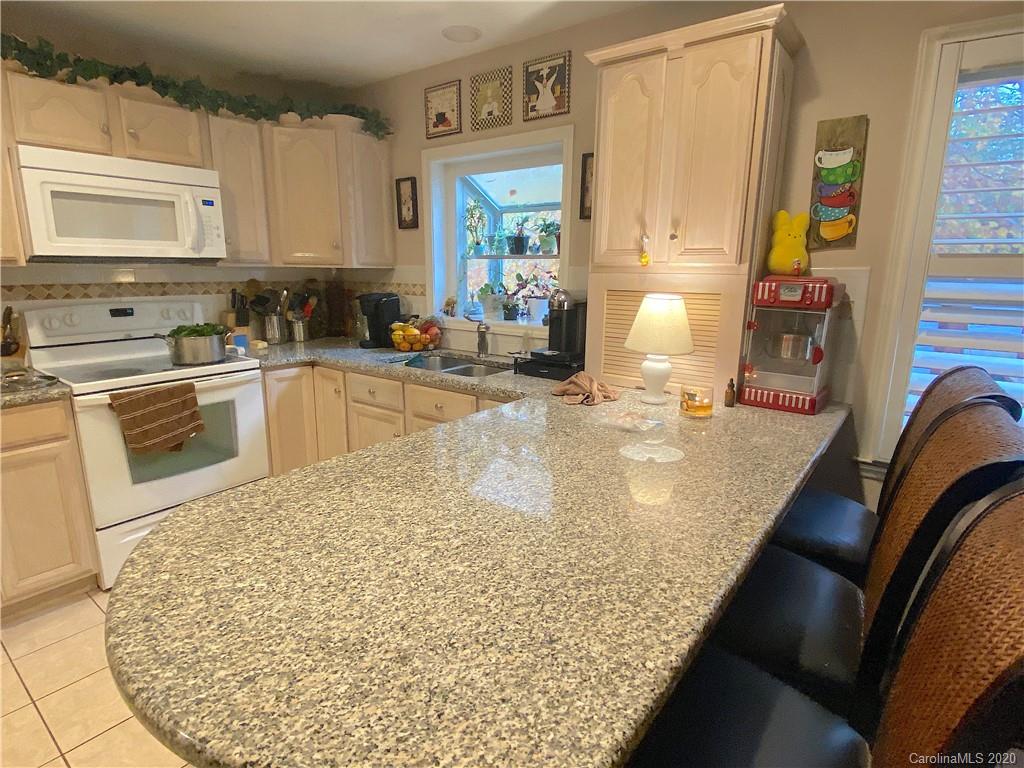 103 Sycamore Road, Unit 208 Salisbury, NC 28147 - Photo 8 of 20 a kitchen with stainless steel appliances granite countertop a sink and cabinets