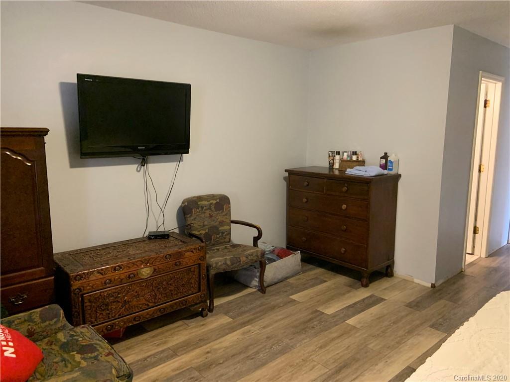 103 Sycamore Road, Unit 208 Salisbury, NC 28147 - Photo 10 of 20 a room with furniture and flat screen tv
