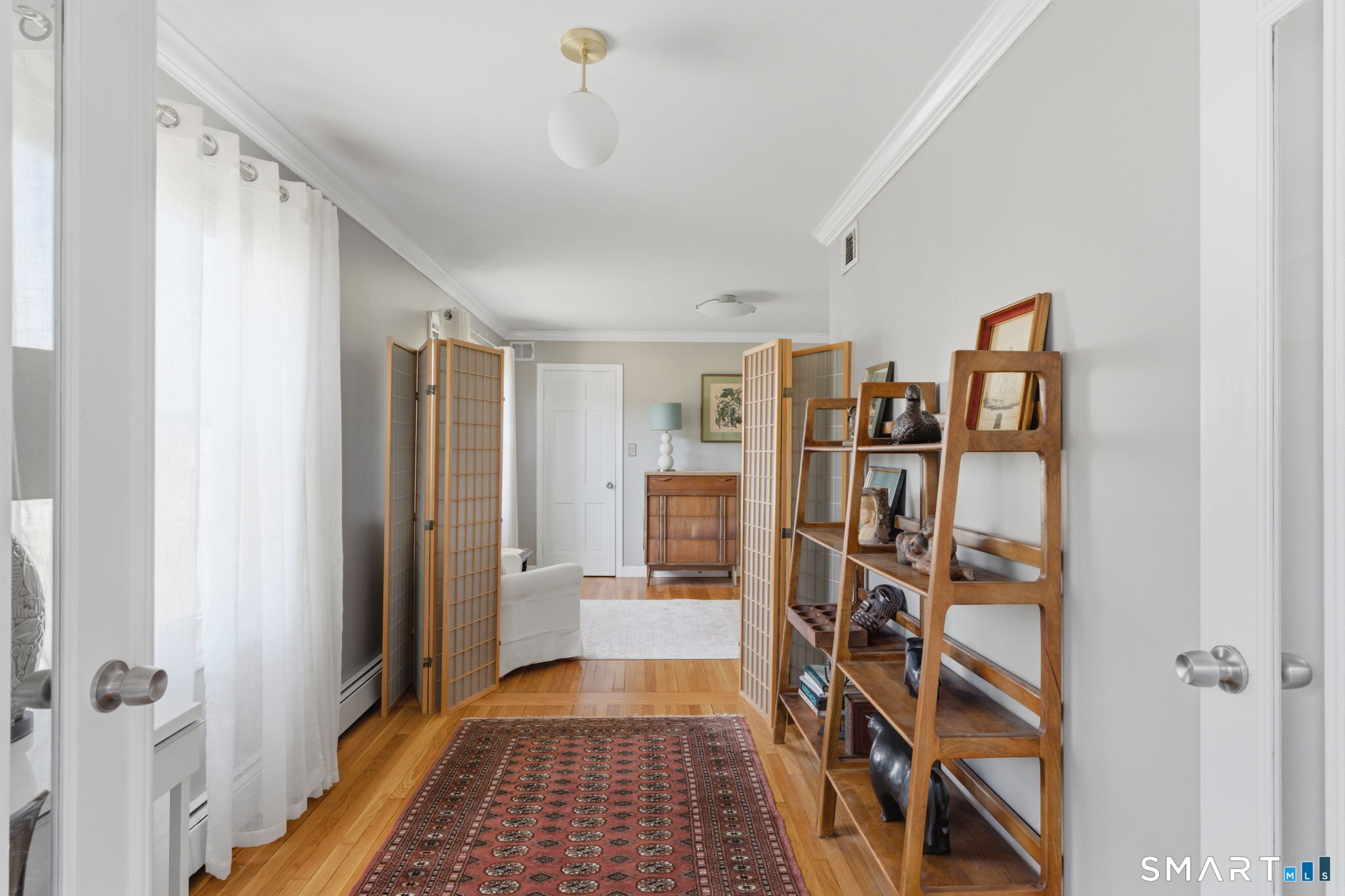 192 Dexter Avenue Meriden, CT 06450 - Photo 14 of 40 a view of a hallway with wooden floor and closet