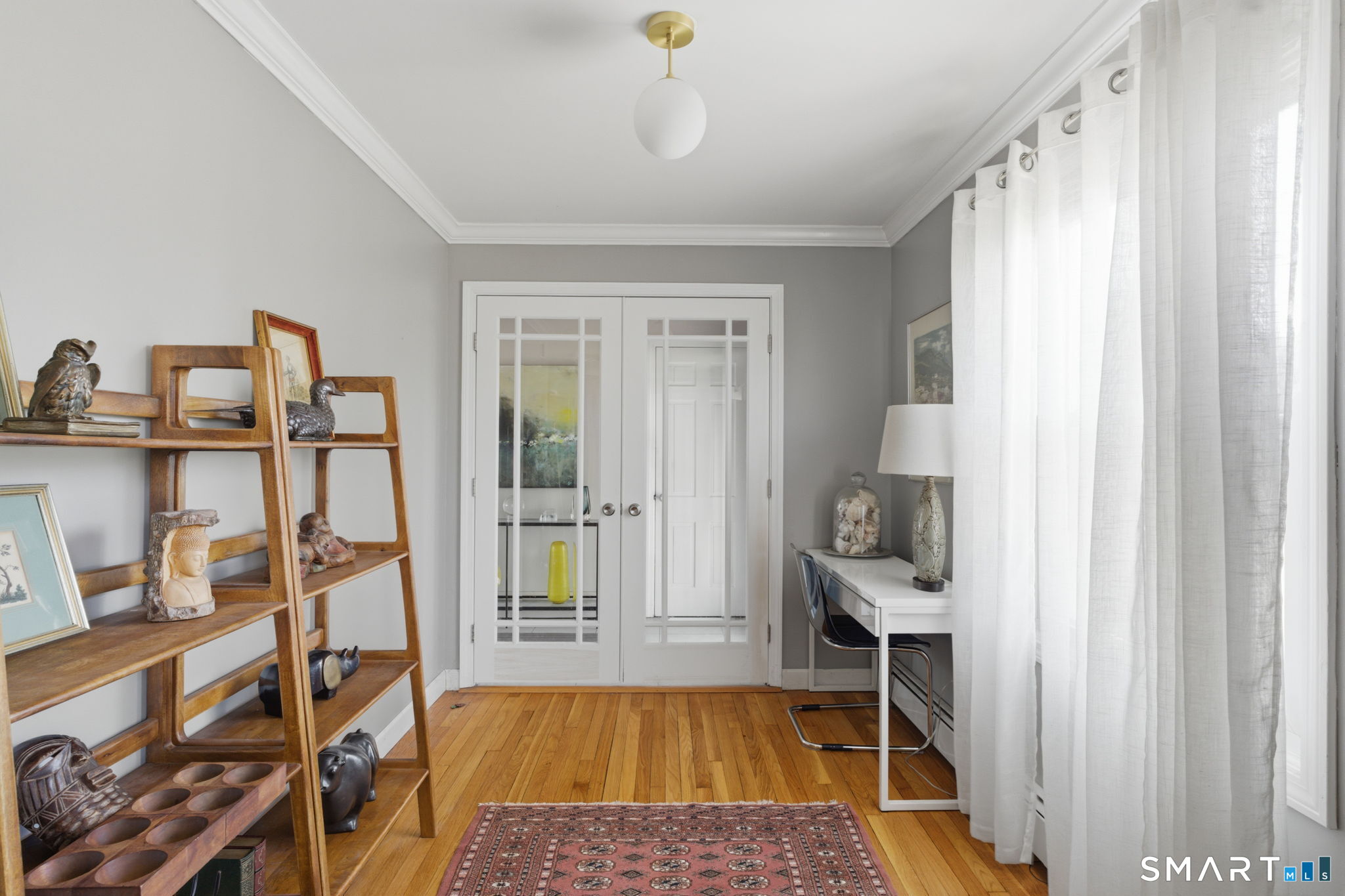 192 Dexter Avenue Meriden, CT 06450 - Photo 17 of 40 a bed room with a bed and a book shelf