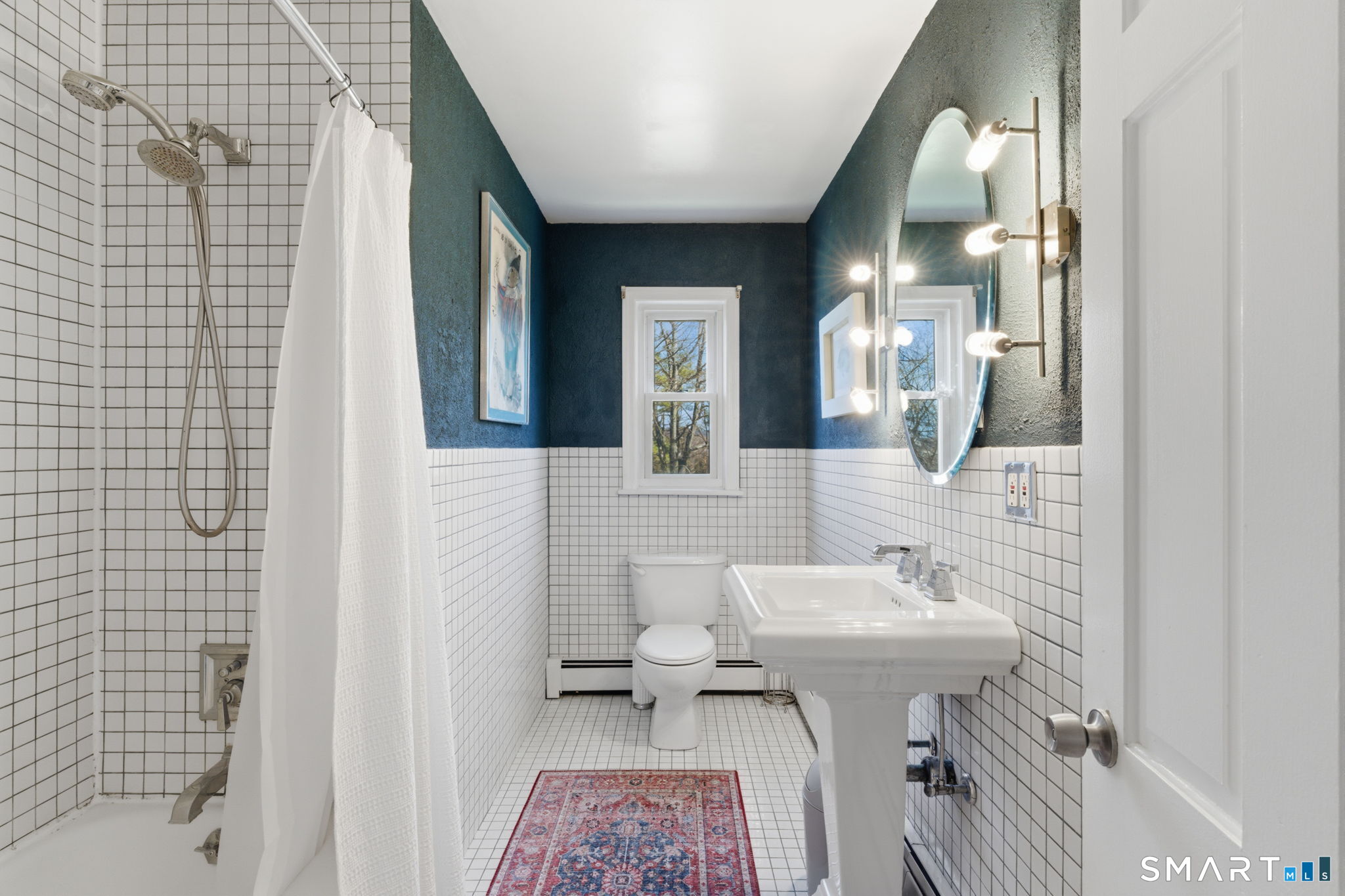 192 Dexter Avenue Meriden, CT 06450 - Photo 19 of 40 a bathroom with a sink a mirror and a shower