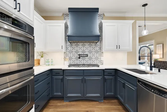 a kitchen with a sink cabinets and window