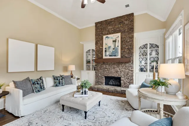 a living room with furniture and a fireplace