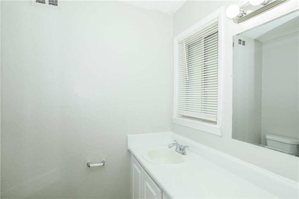 2065 Alison Court Southwest, Unit 8 Atlanta, GA 30311 - Photo 11 of 14 a bathroom with a sink and a bathtub