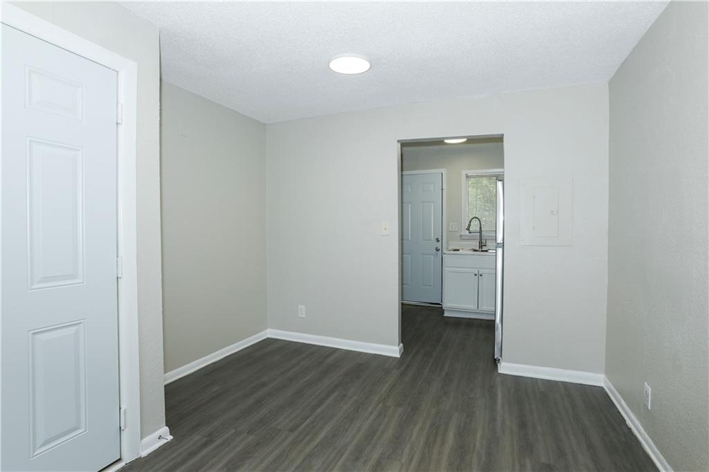 2065 Alison Court Southwest, Unit 8 Atlanta, GA 30311 - Photo 4 of 14 a view of a room with wooden floor