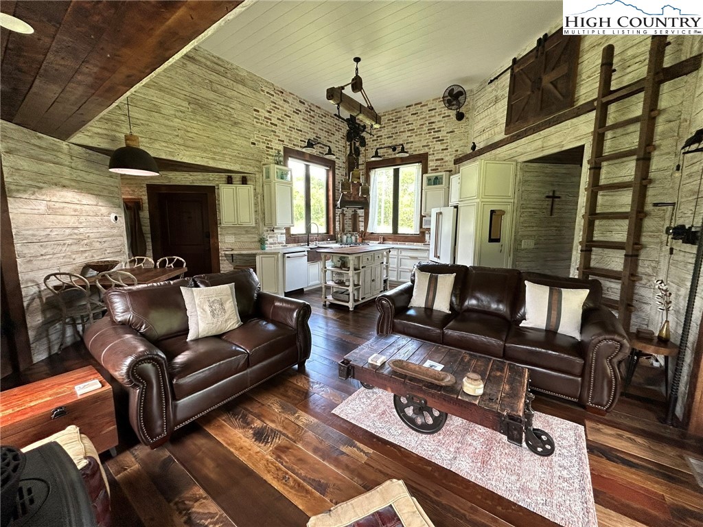 972 West Deep Ford Road Lansing, NC 28643 - Photo 12 of 45 a living room with furniture and a chandelier