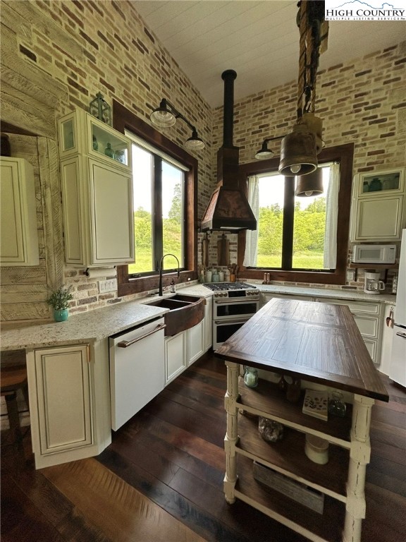 972 West Deep Ford Road Lansing, NC 28643 - Photo 15 of 45 a kitchen with a stove a sink and a wooden floors
