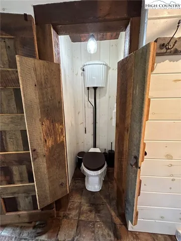 a bathroom with a sink mirror and shower