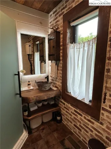 a bathroom with a sink and toilet