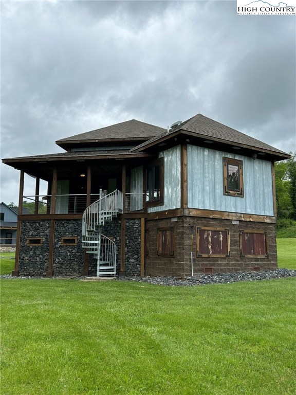 972 West Deep Ford Road Lansing, NC 28643 - Photo 29 of 45 a front view of a house with a garden