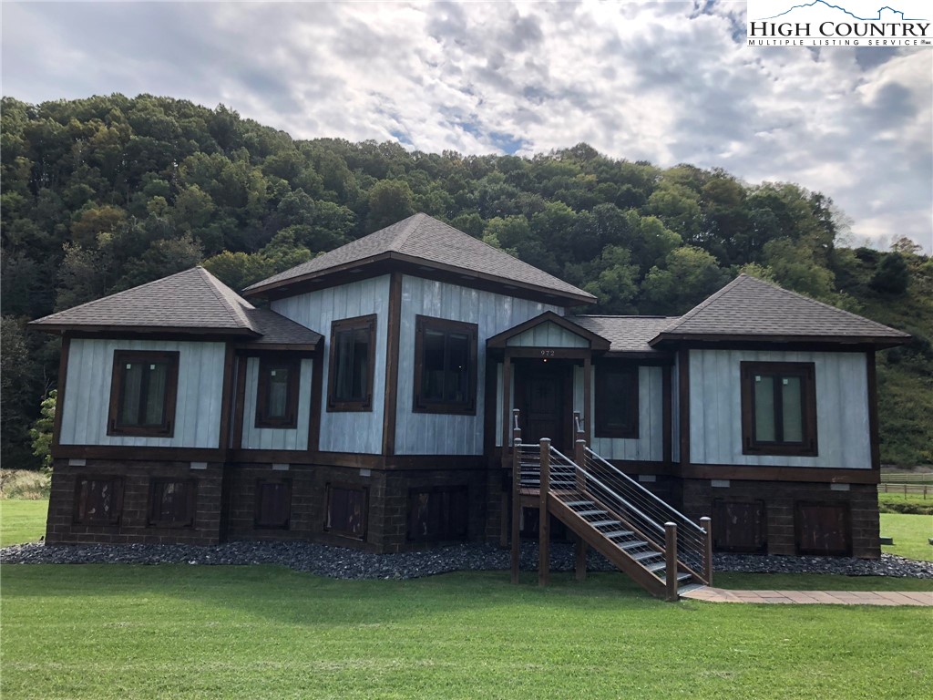 972 West Deep Ford Road Lansing, NC 28643 - Photo 31 of 45 a front view of a house with a garden