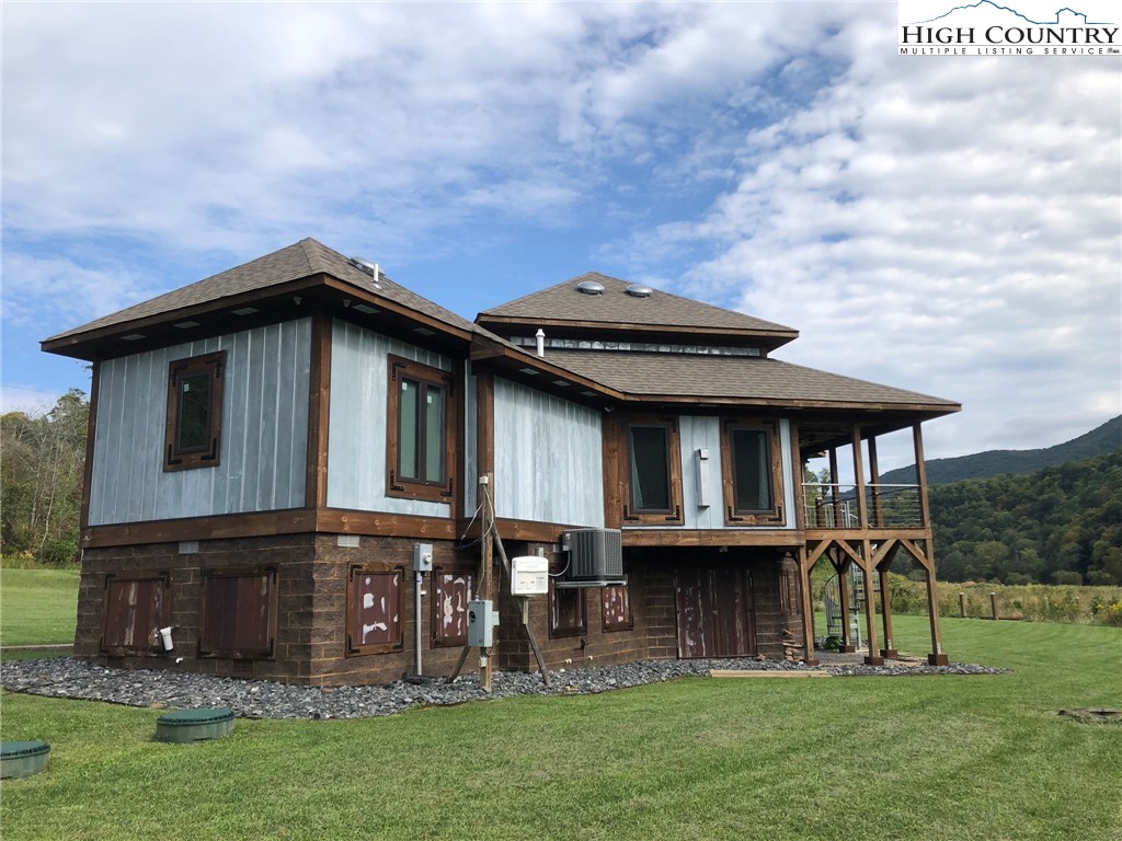 972 West Deep Ford Road Lansing, NC 28643 - Photo 32 of 45 a view of a house with a backyard