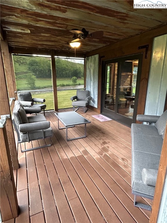 972 West Deep Ford Road Lansing, NC 28643 - Photo 34 of 45 a living room with patio furniture and a floor to ceiling window