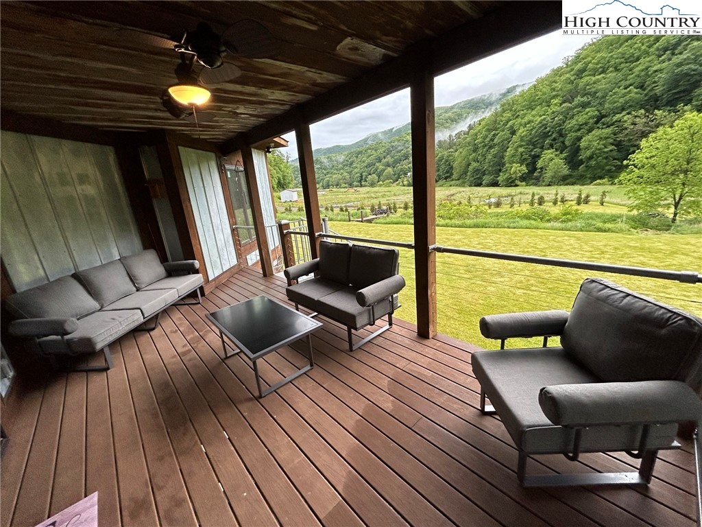 972 West Deep Ford Road Lansing, NC 28643 - Photo 36 of 45 a balcony with furniture and wooden floor