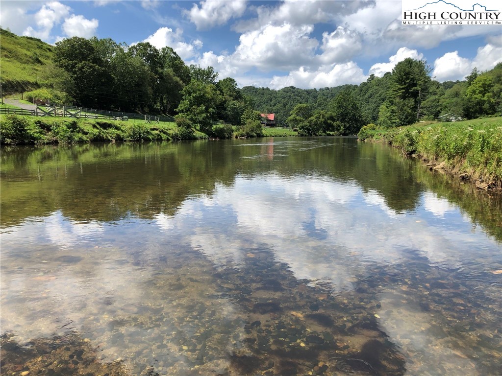 972 West Deep Ford Road Lansing, NC 28643 - Photo 41 of 45 a view of a lake with houses in the background