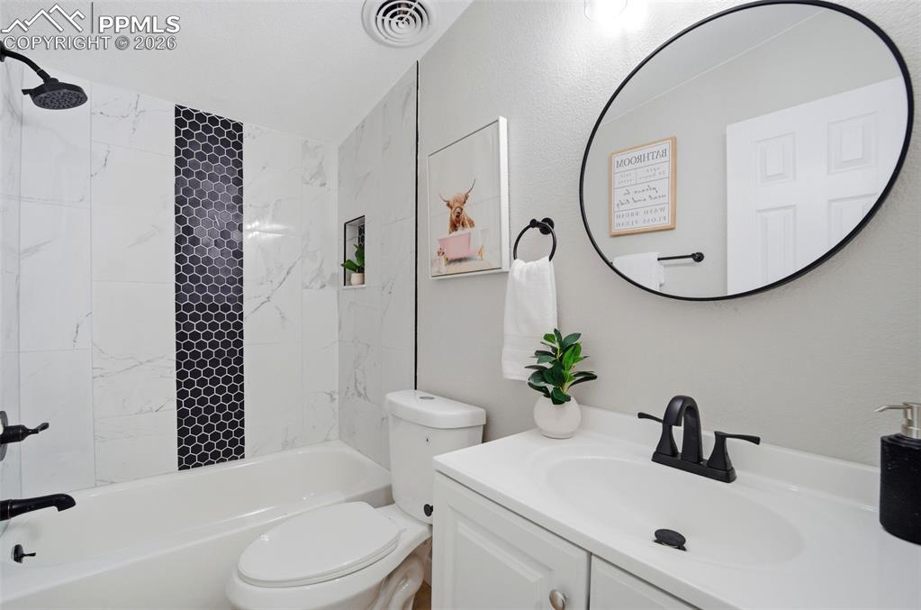 35125 Book Road Yoder, CO 80864 - Photo 28 of 45 a bathroom with a sink a toilet and a mirror