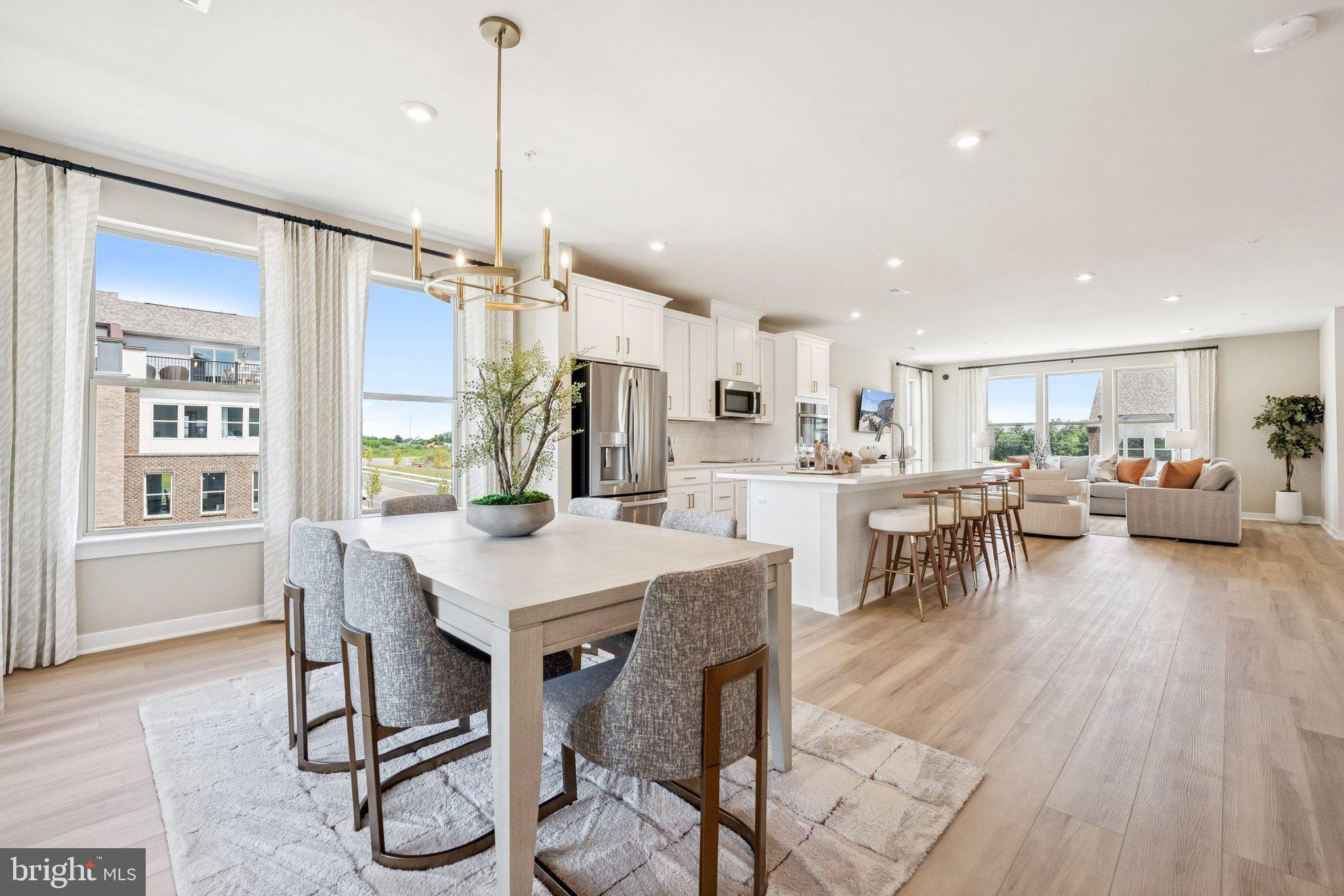 8654 Lovelace Street Manassas, VA 20110 - Photo 10 of 32 a view of a dining room with furniture window and wooden floor