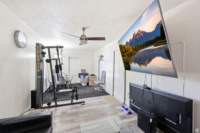 5480 South 2000th Street West Roy, UT 84067 - Photo 24 of 36 Open concept living space featuring wood-finish flooring and a ceiling fan