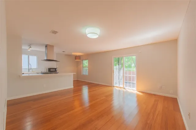 a kitchen with stainless steel appliances granite countertop a stove and a refrigerator
