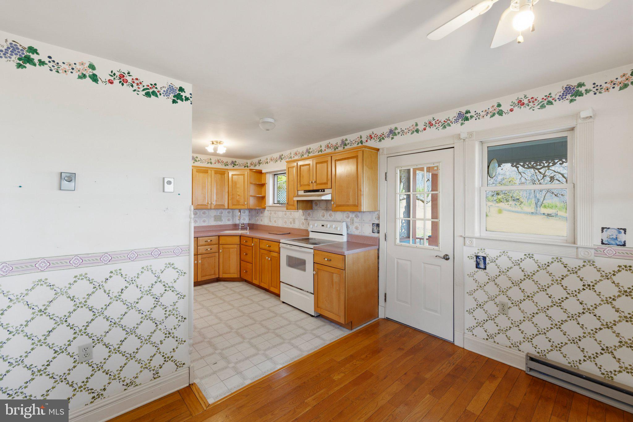 777 Glengary Road Winchester, VA 22603 - Photo 20 of 69 a kitchen with granite countertop a sink cabinets and stainless steel appliances