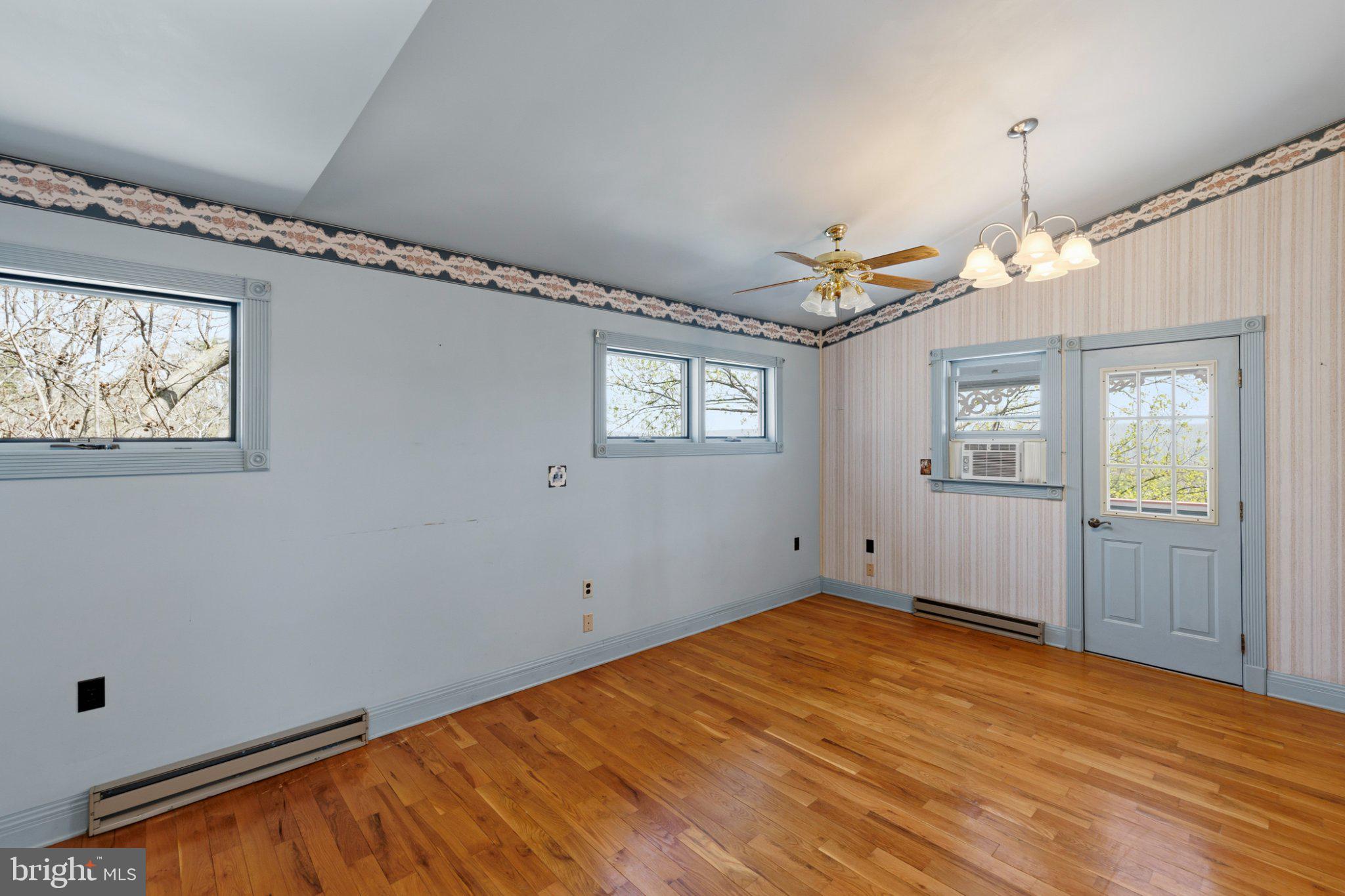 777 Glengary Road Winchester, VA 22603 - Photo 27 of 69 a view of empty room with wooden floor and fan
