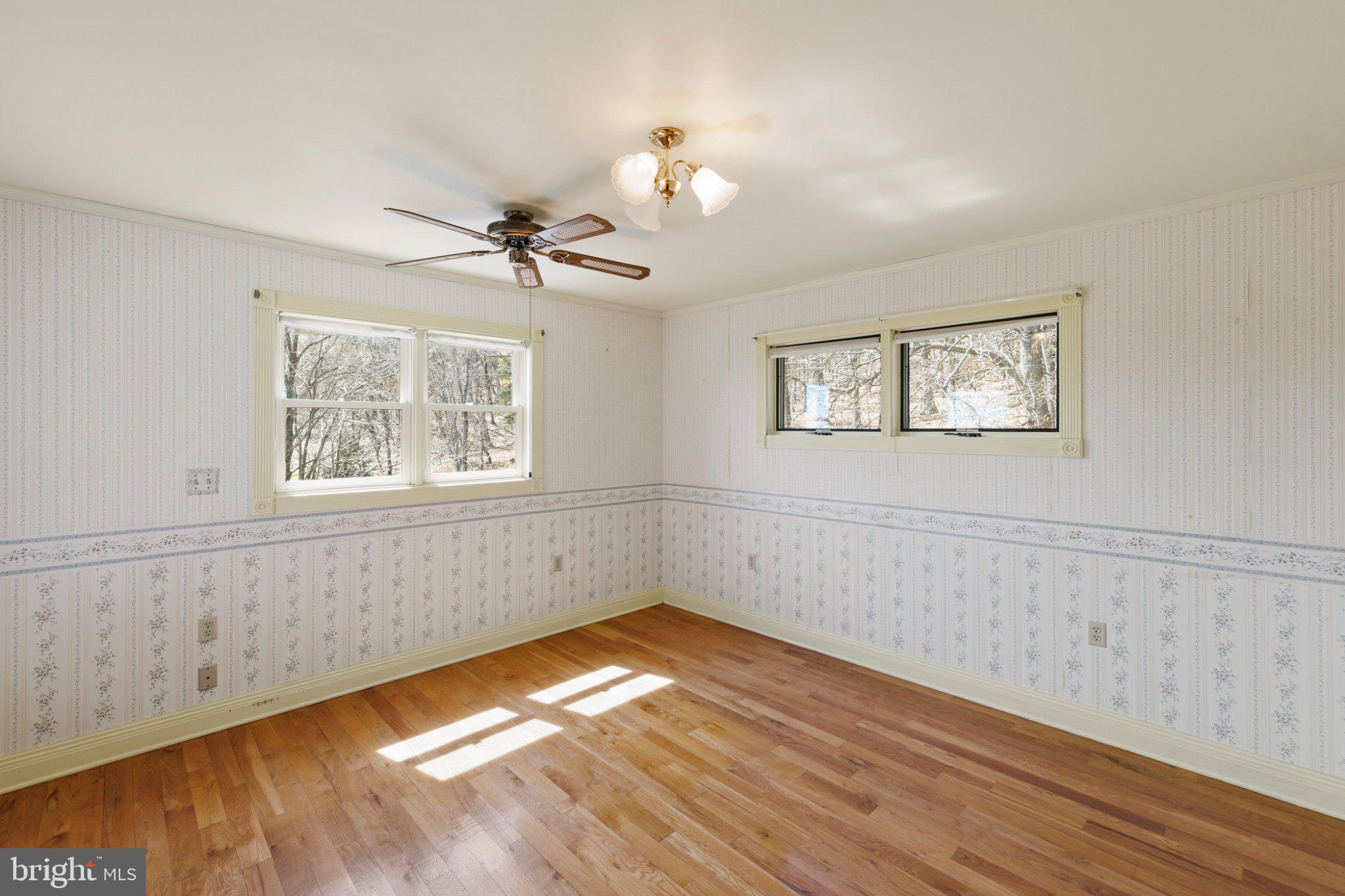 777 Glengary Road Winchester, VA 22603 - Photo 37 of 69 a view of empty room with wooden floor and fan